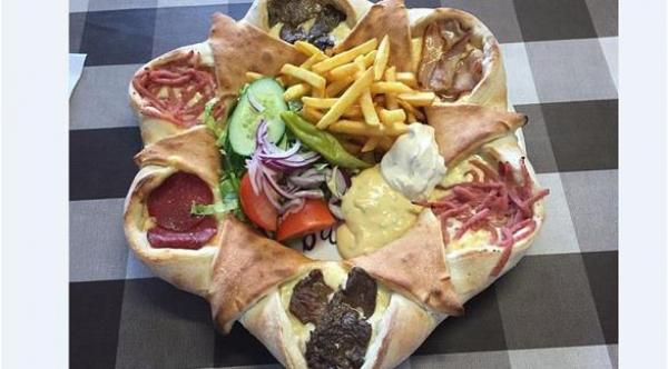  سعر البيتزا بـ9.30 جنية استرليني بمطعم &quot;Nya Gul &amp; Blå pizzeria in Piteå&quot; شمالي السويد 